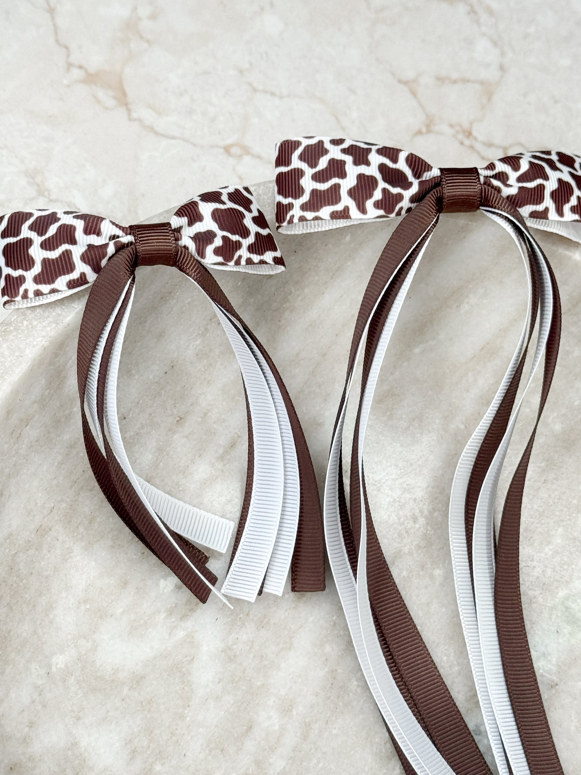 Cow Print Florence Tassel Bow